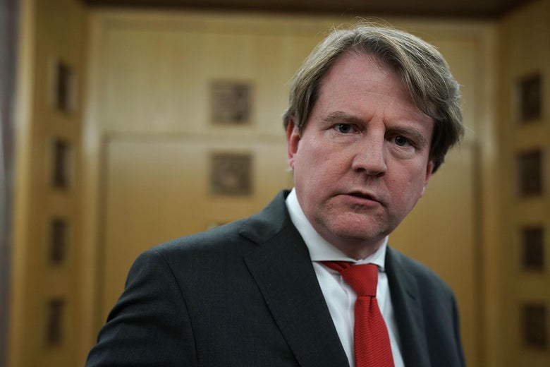 Don McGahn in a dark suit and red tie.